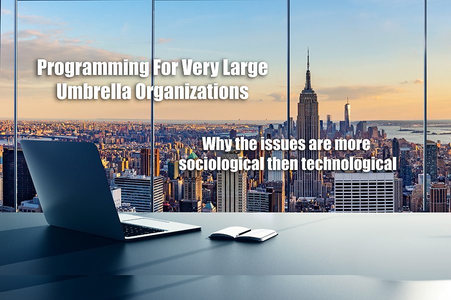 New York City in the background viewed from an office building with a laptop and notebook calendar in the foreground.