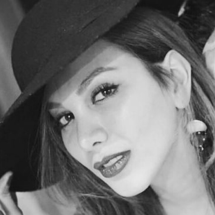 Close-up photo of Ziba Yazdanfar, wearing a hat and smiling.